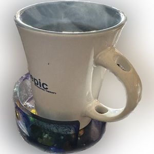 Raised coaster with opening